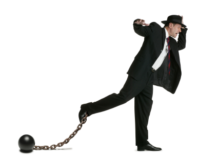 Business man with ball and chain